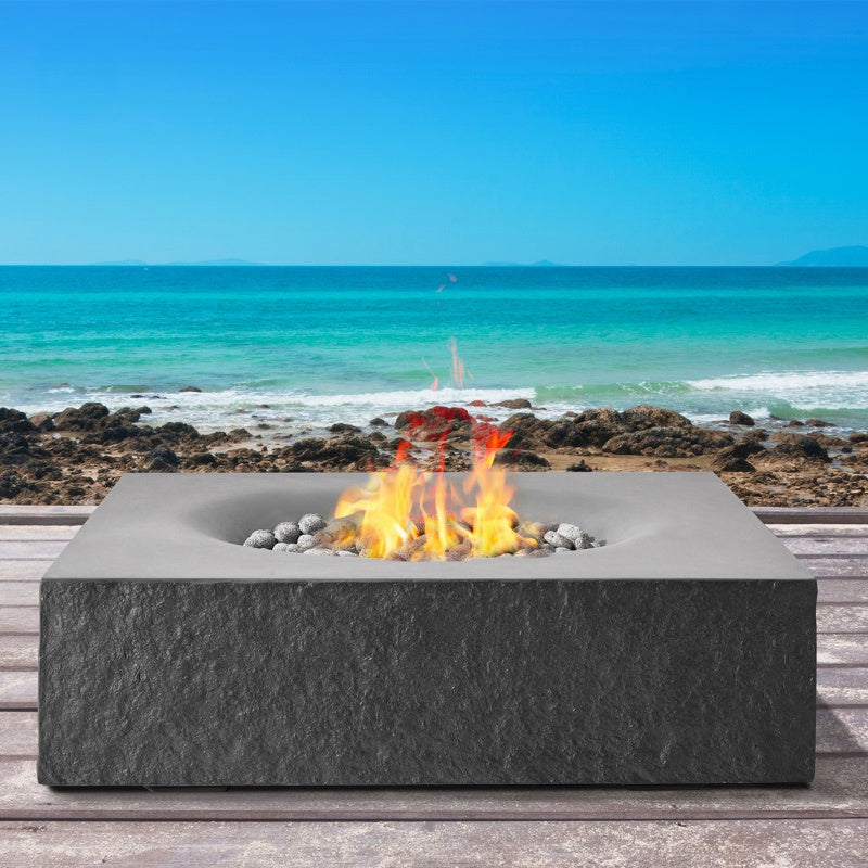 Square concrete fire pit on beachfront deck