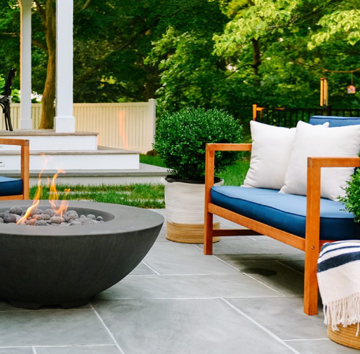 Sleek black concrete fire bowl with flame